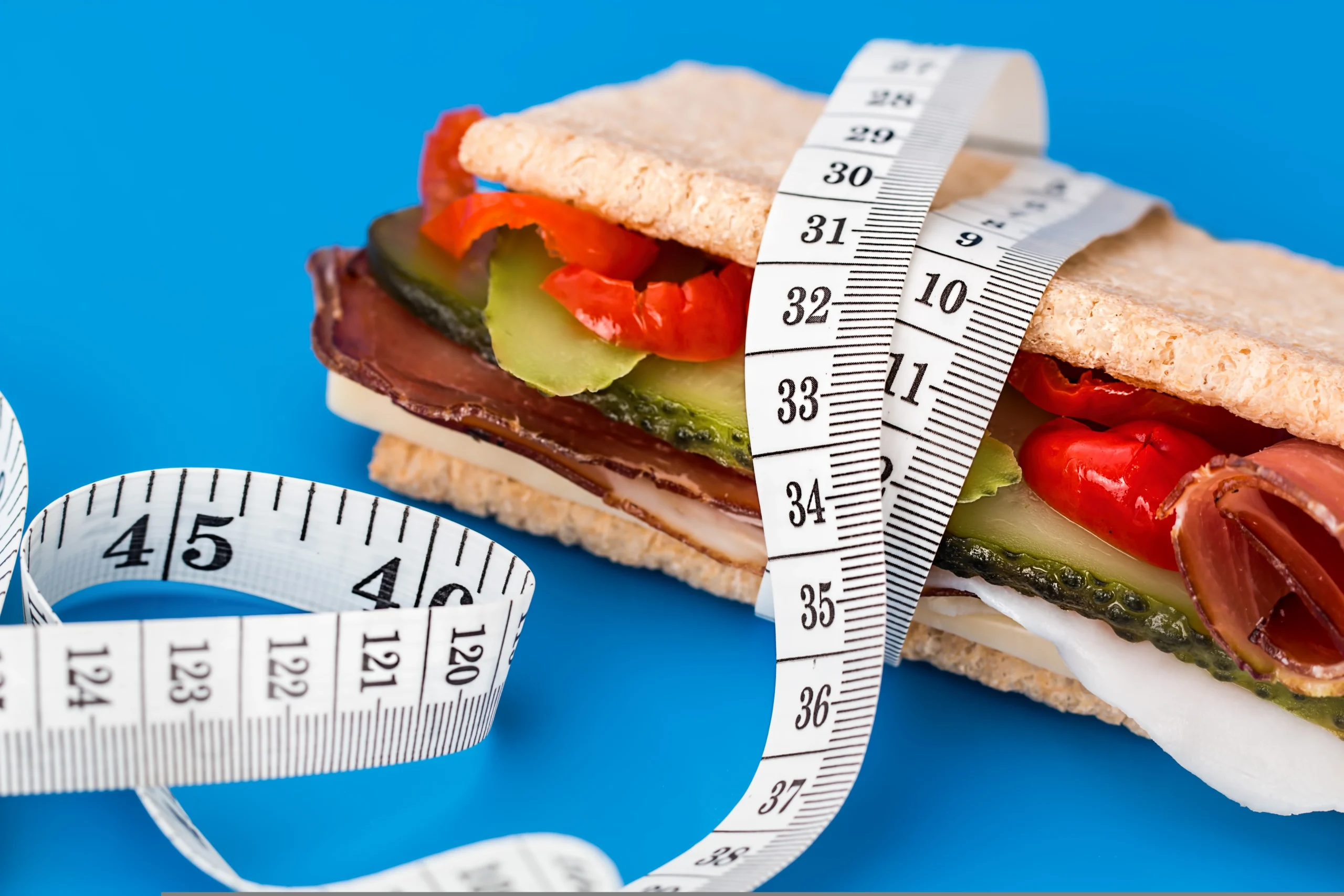 diet food sandwich with measuring tape calorie control macro tracking iifym
