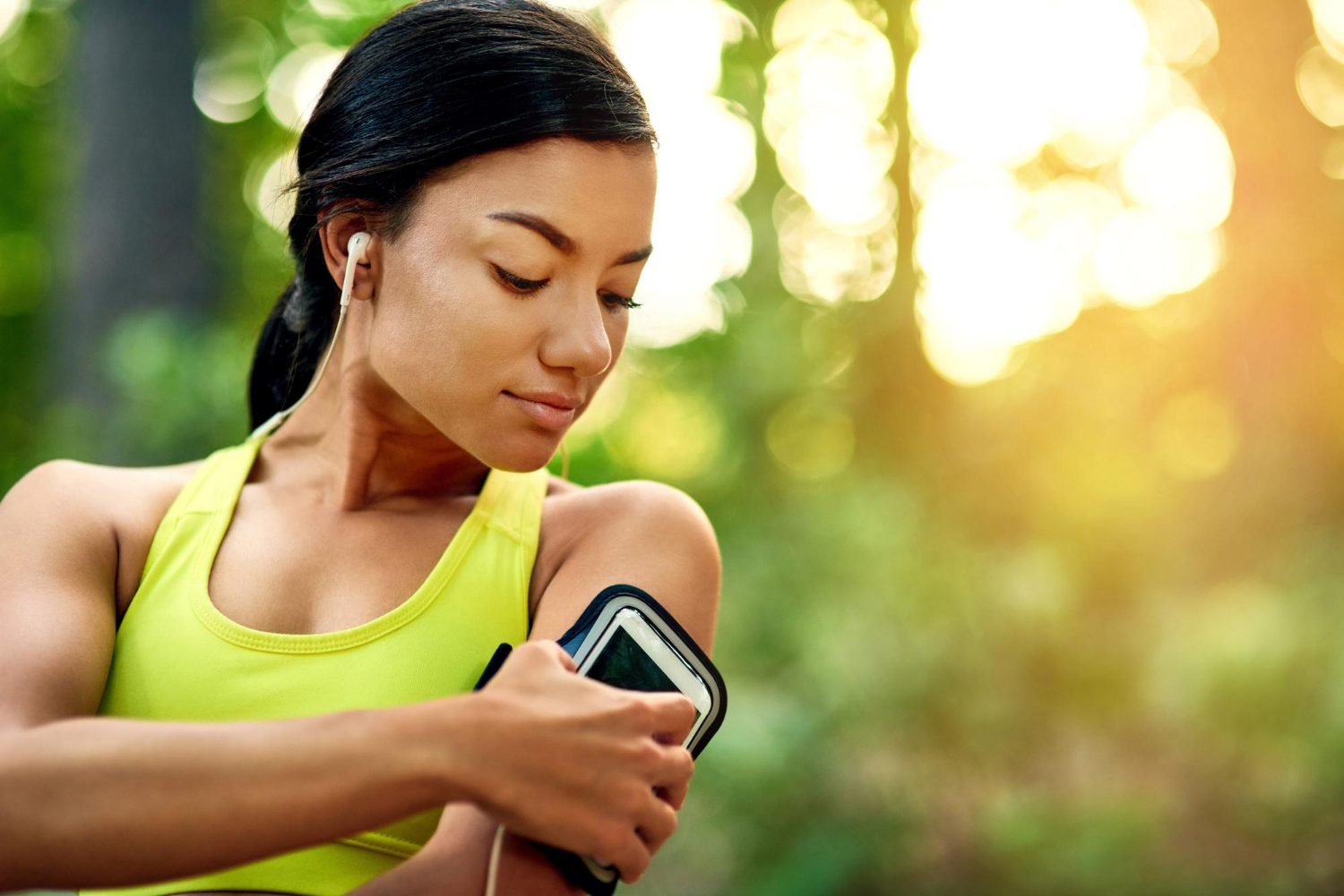 Outdoor woman and cellphone for music before fitness running