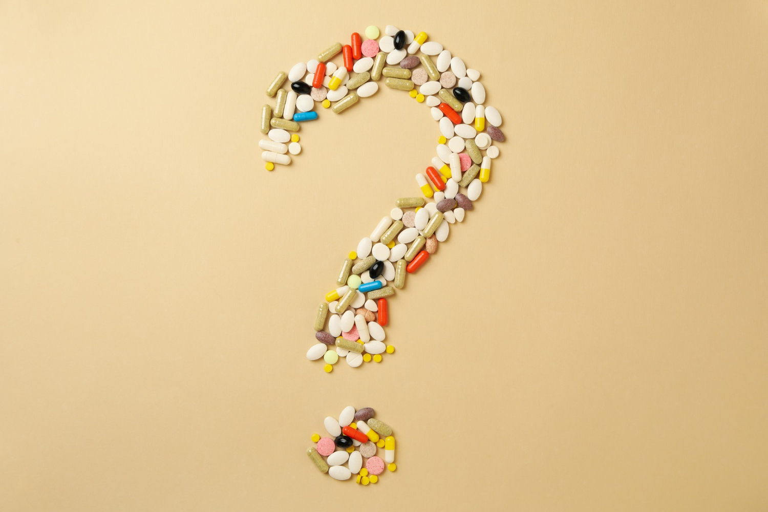 weight-loss-pills-1 Question mark made of pills on beige