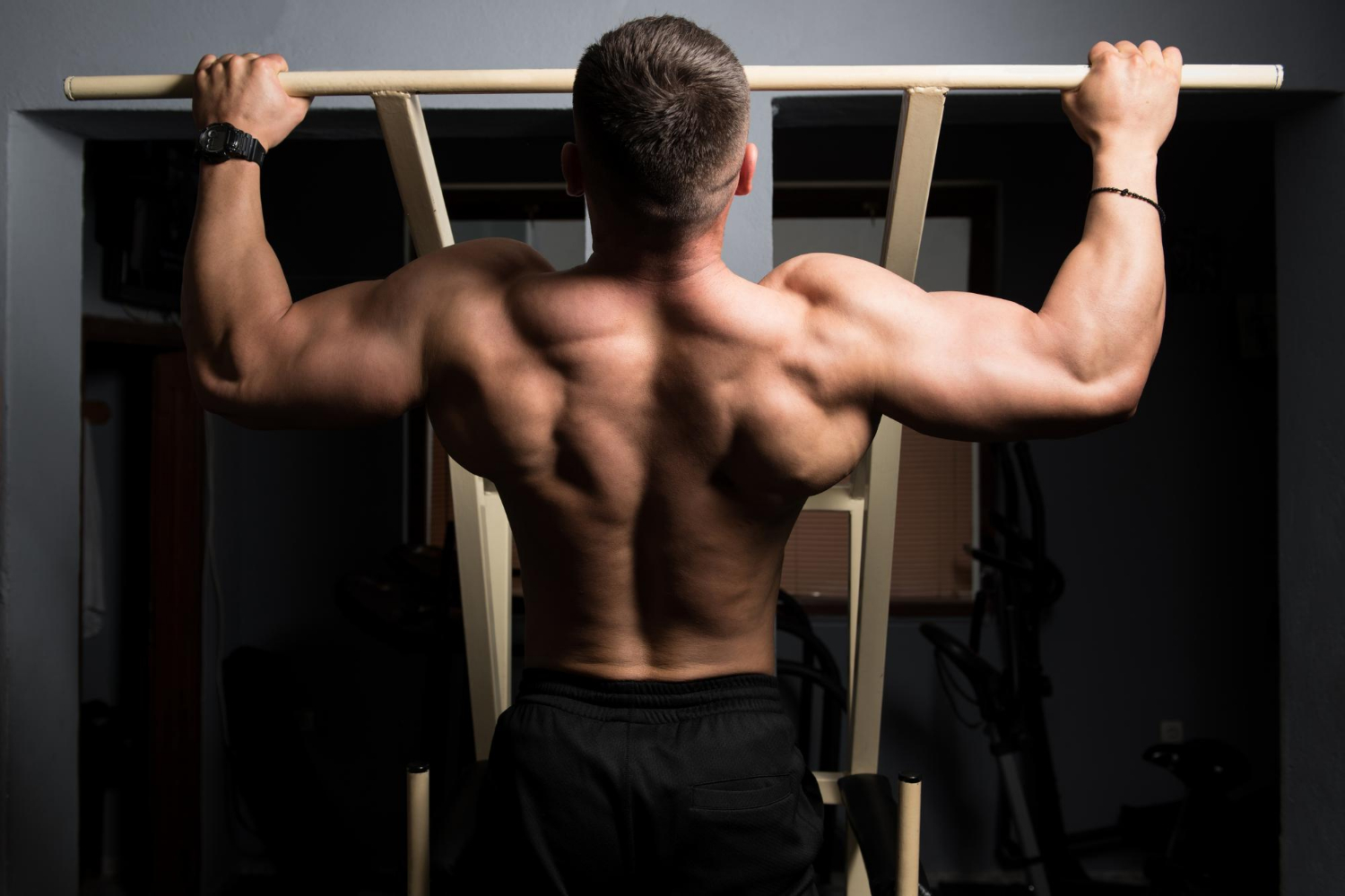 Male athlete doing pull ups